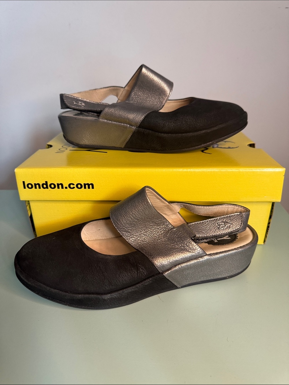 Fly London Black and Metallic Silver Slingback Clogs